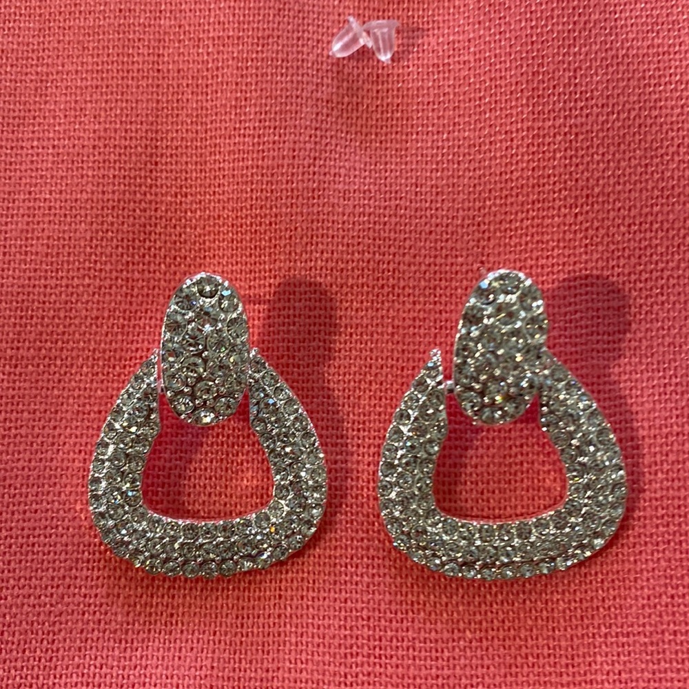 Silver tone earrings with rhinestones